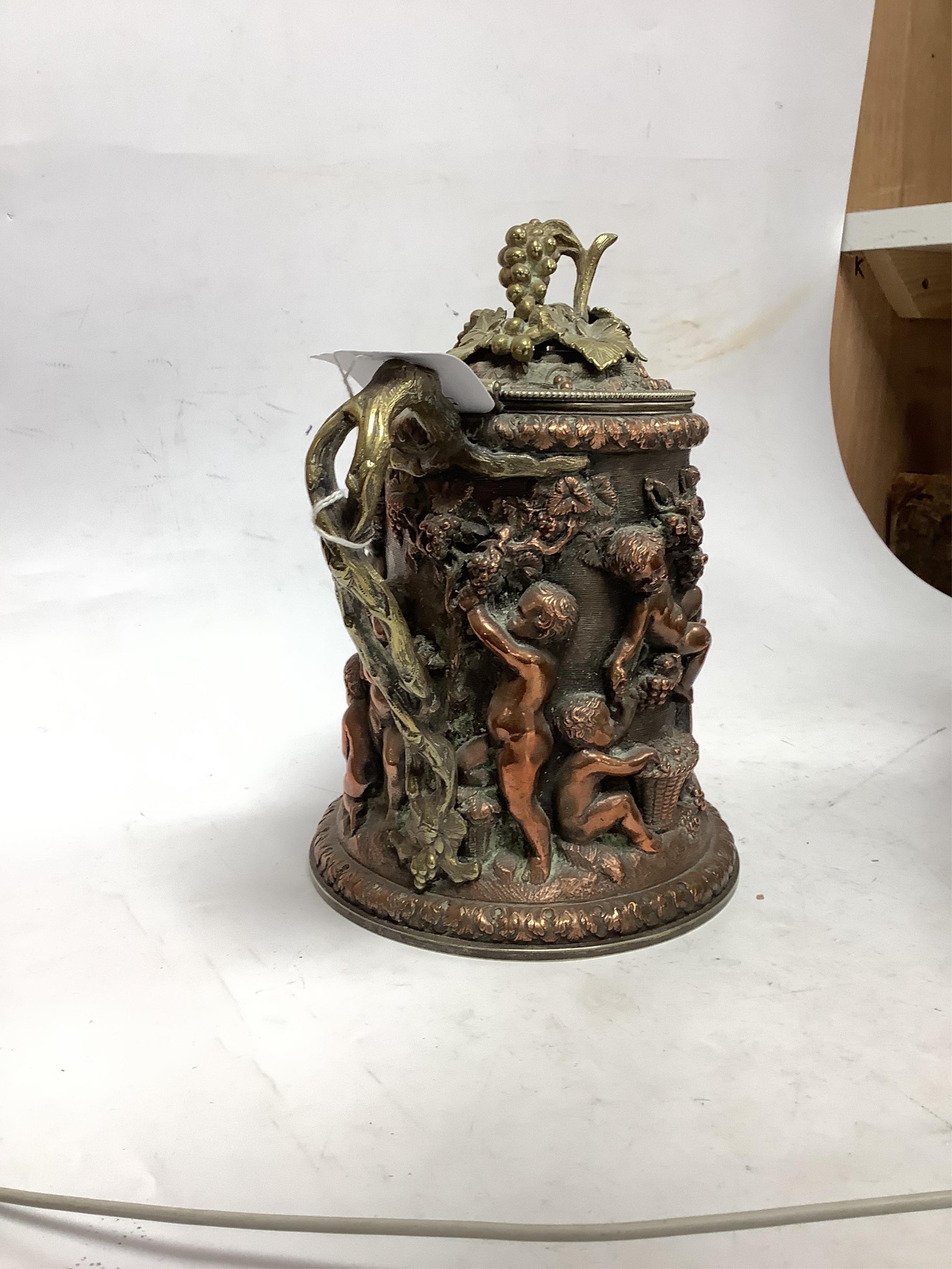 A copper Bacchus jug trophy, presentation inscription 1872, 21cm